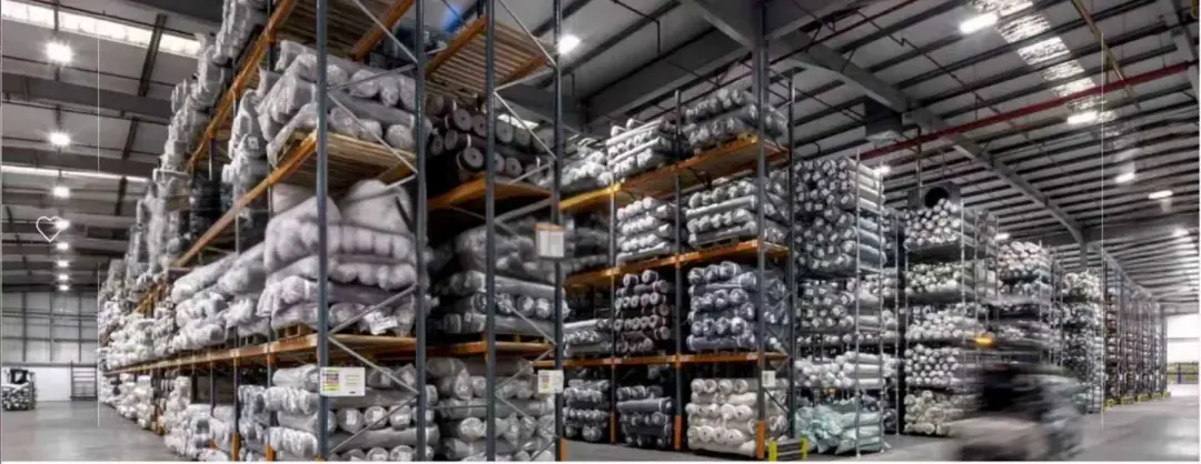 rolls of fabric in textile storage
