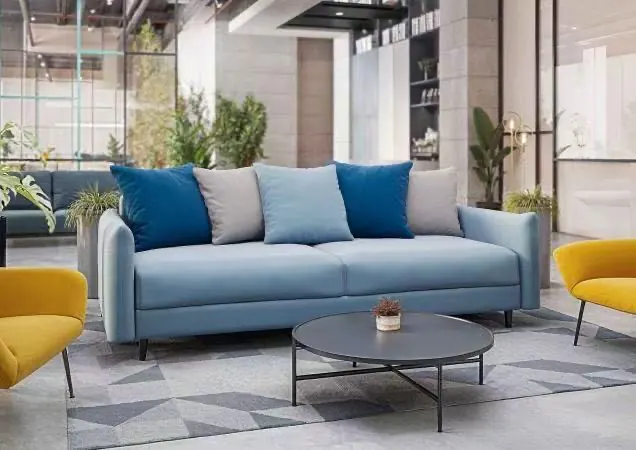 Blue upholstered sofa in a furnished interior
