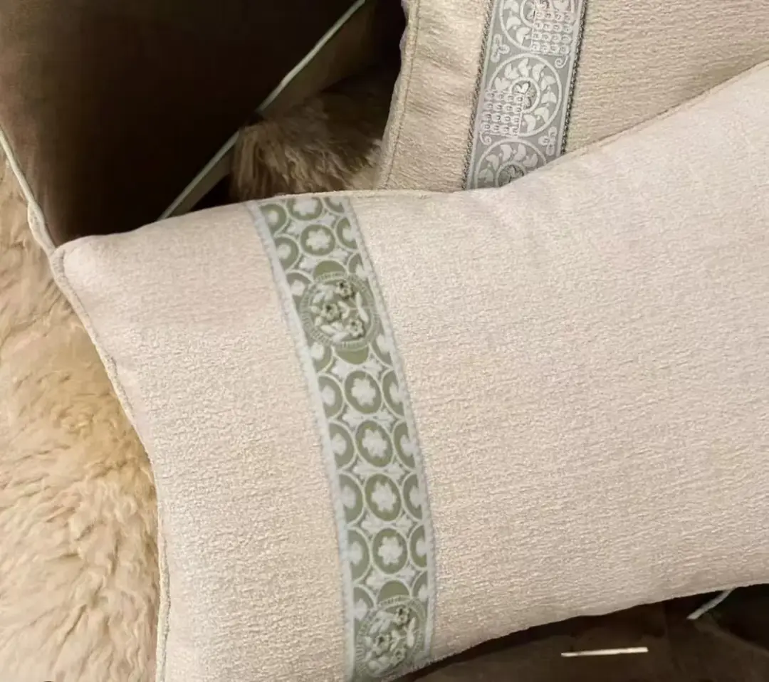 Linen cushion with piping and an applied decorative band