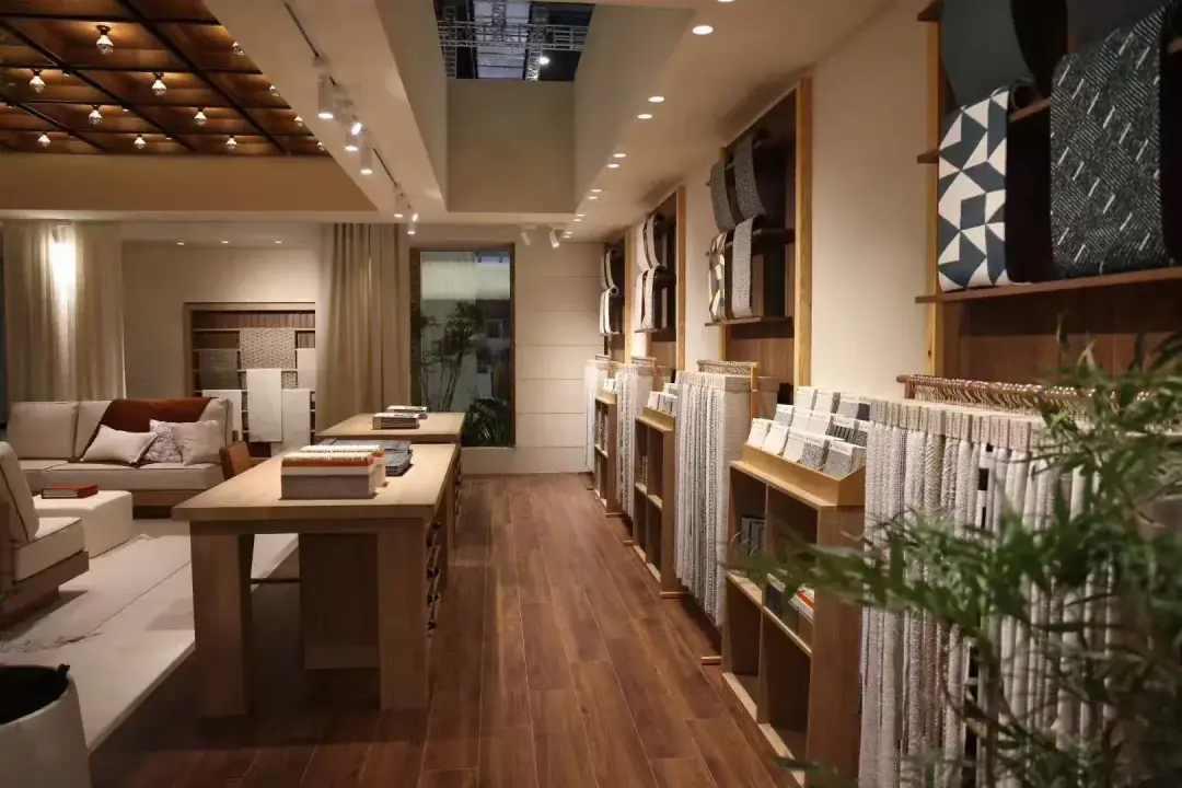 Trade showroom with fabric displays and consultation table