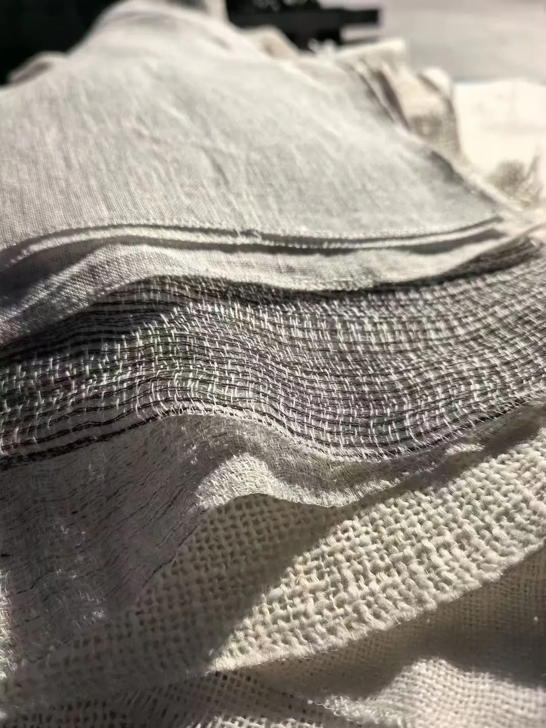 Close-up layers of woven fabrics with different structures