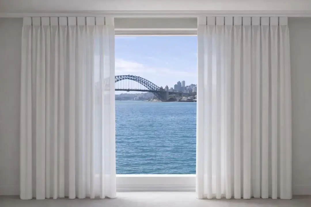 Double-layer curtains at a waterside window