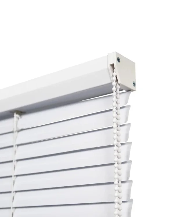 Close-up of an aluminium venetian blind headrail and slats