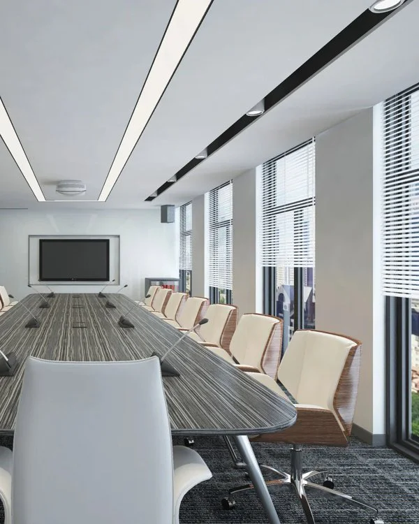 White aluminium venetian blinds along boardroom windows