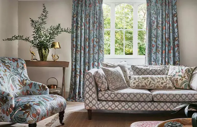 Coordinated printed curtains and upholstered sofa